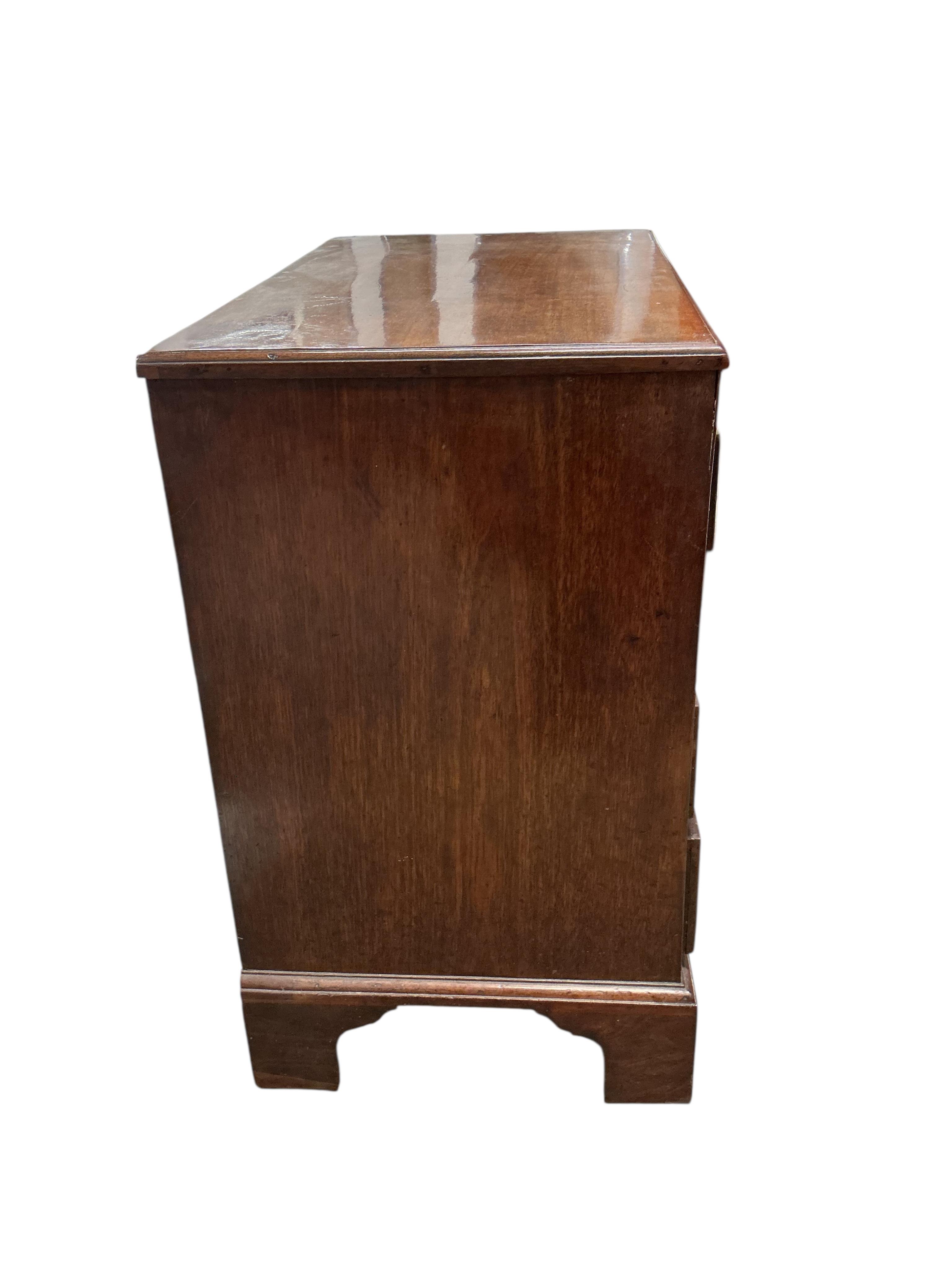 A small George III mahogany four drawer chest with brushing slide, width 78cm, depth 46cm, height 79cm